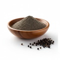 Black pepper powder in wooden bowl close-up
