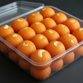 Motichoor Laddu in plastic box - open 45 degree